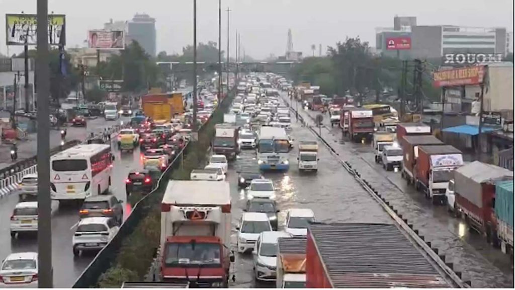 Gurugram Heavy Rain Nh48 Road Collapse 10km Traffic Jam Flooding